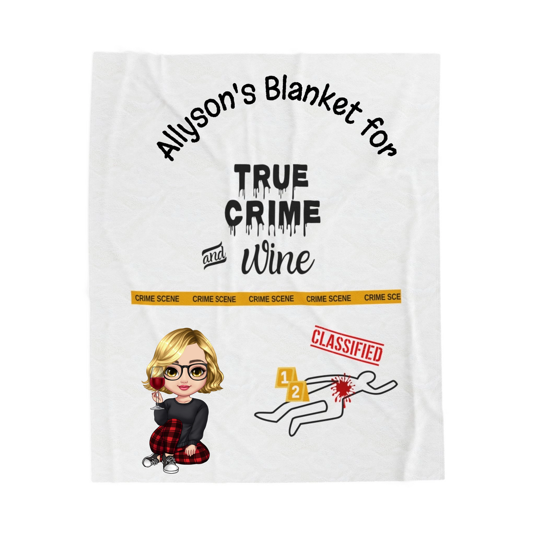 Blanket with text and graphics including 'Allyson's Blanket for True Crime and Wine' and cartoon character.
